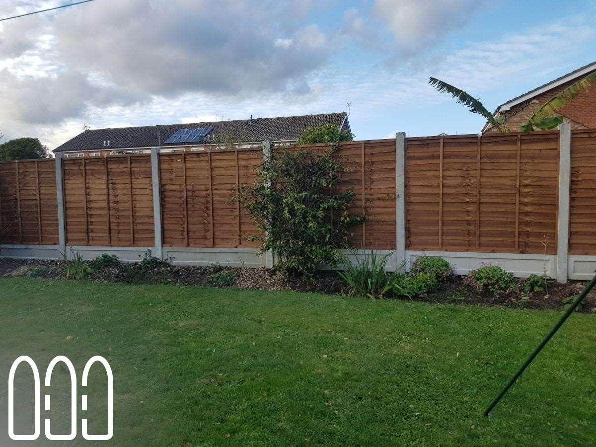 Waney fencing with concrete posts and gravel boards