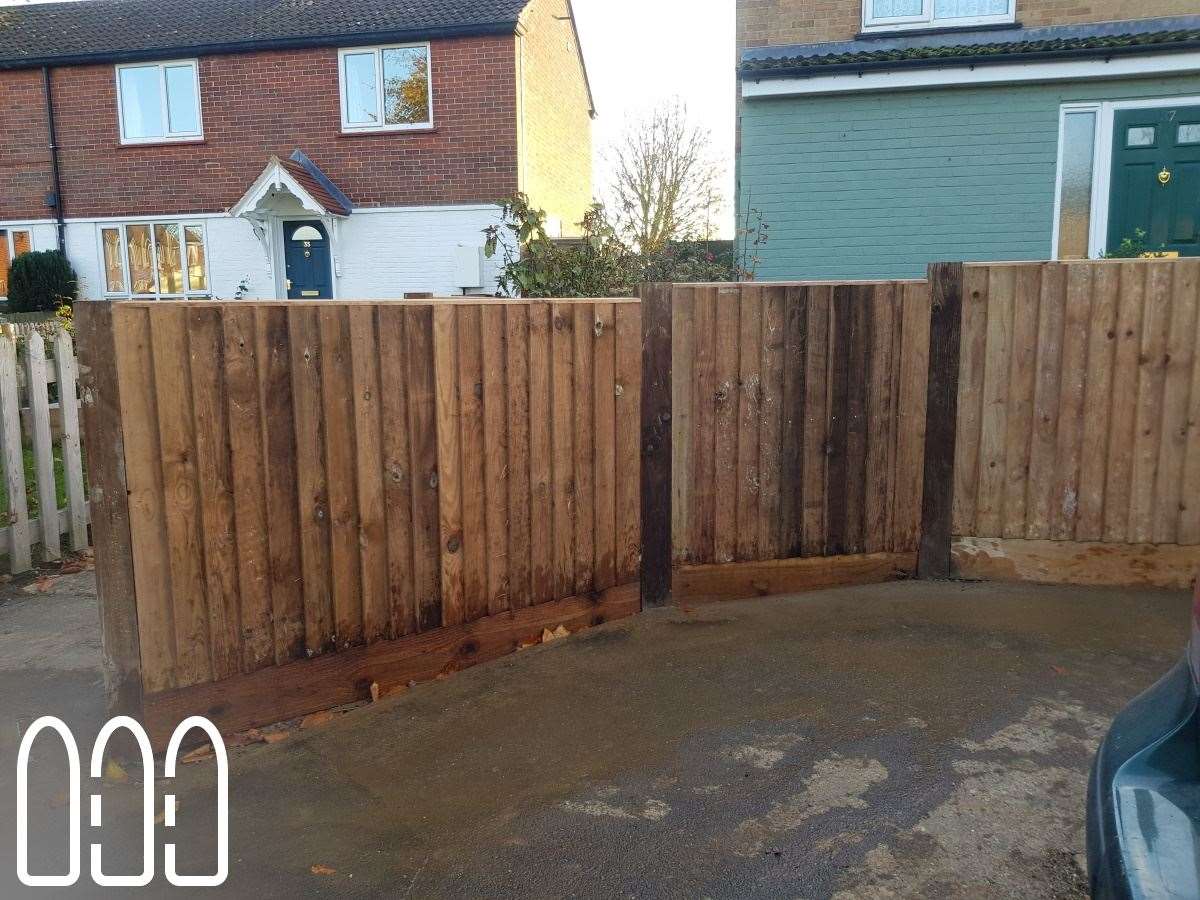 Close board fencing with wooden posts and gravel boards