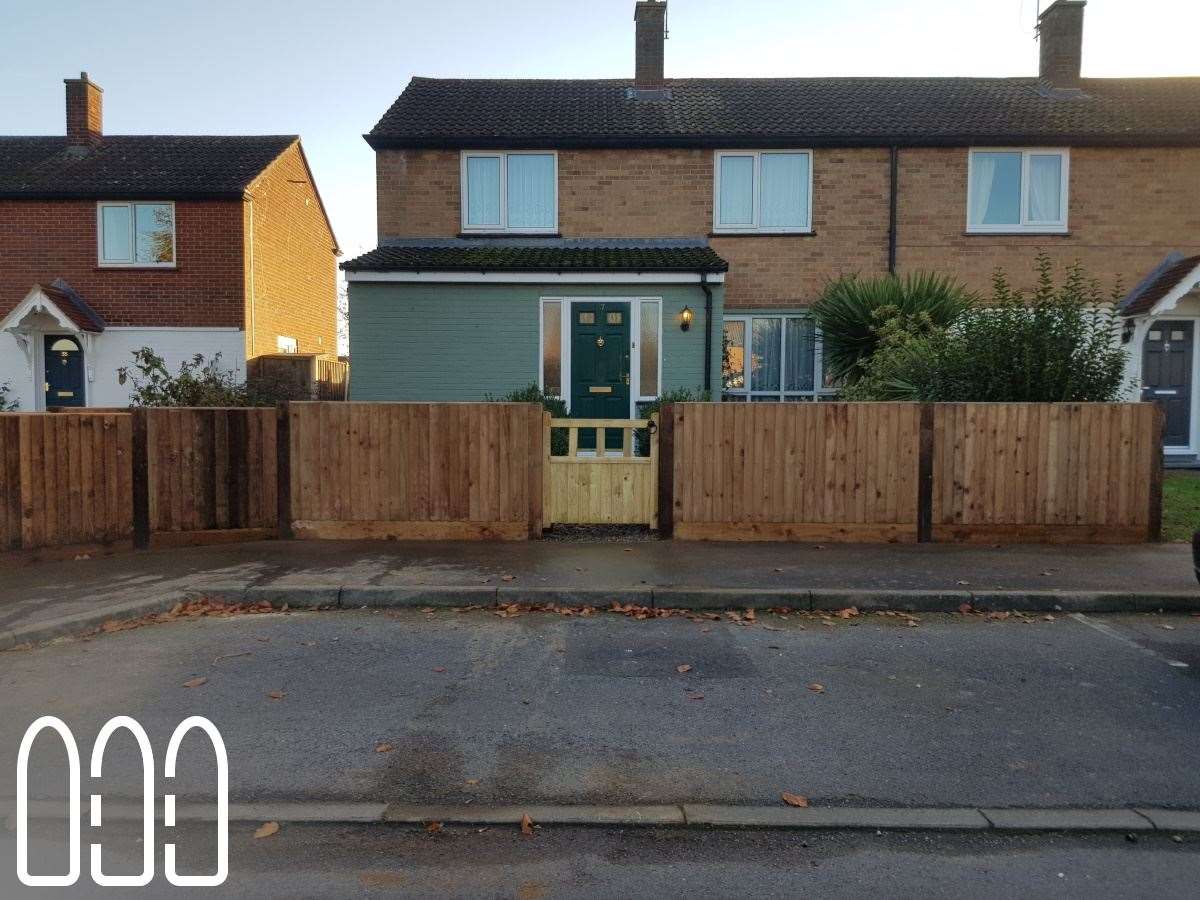 Close board fencing with wooden posts and gravel boards