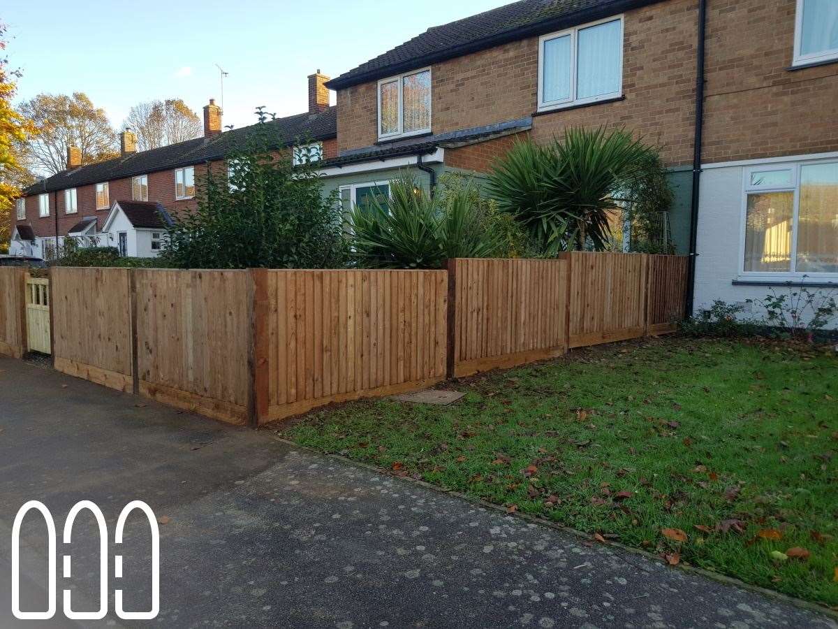 Close board fencing with wooden posts and gravel boards