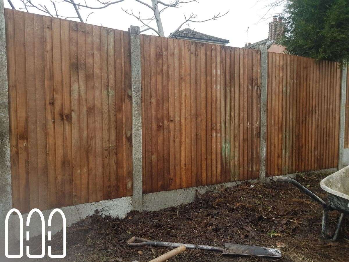 Close board fencing with concrete posts and gravel boards