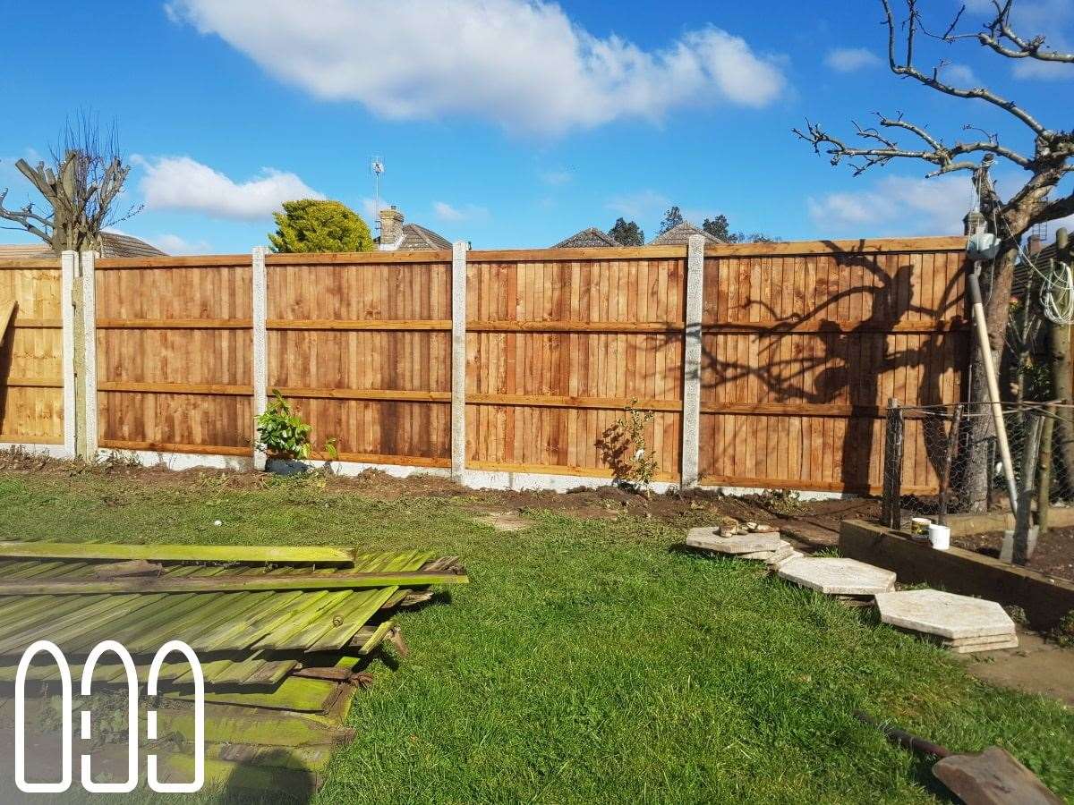 Close board fencing with concrete posts and gravel boards