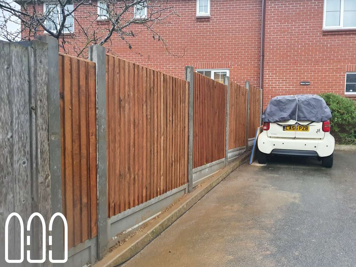 Close board fencing with concrete posts and gravel boards