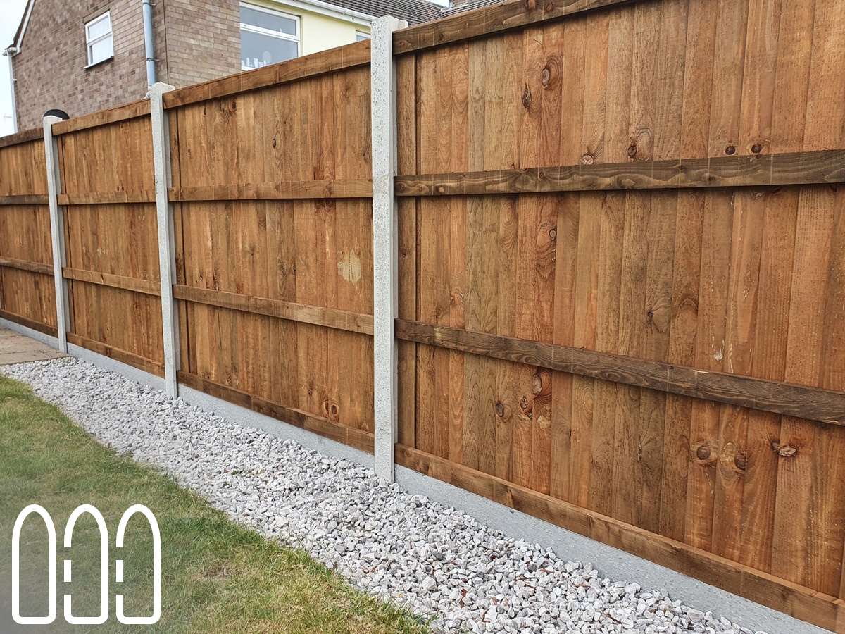 Close board fencing with concrete posts and gravel boards