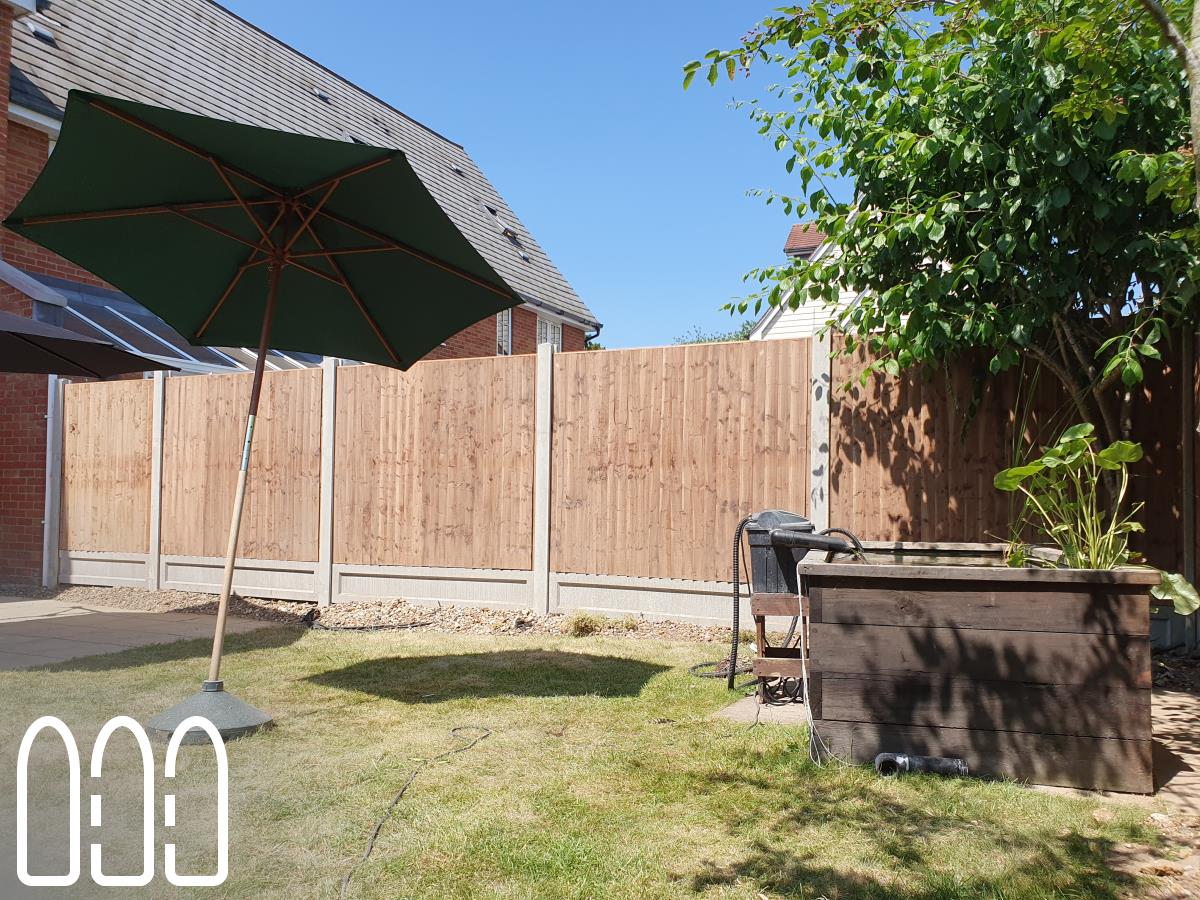 Installation of a new fence built from concrete posts, concrete gravel boards and close board feather edge fence panels.