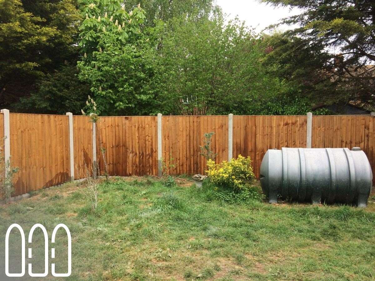 Close board fencing with concrete posts and gravel boards