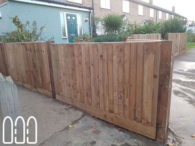 Close board fencing with wooden posts and gravel boards