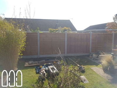 Grange waney fencing with concrete posts and gravel boards