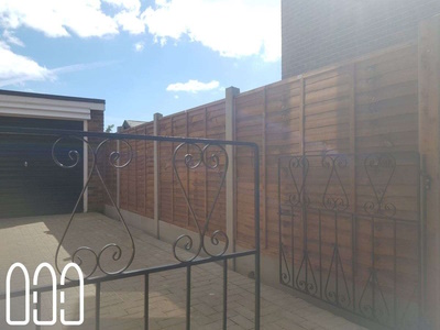 Grange waney fencing with concrete posts and gravel boards