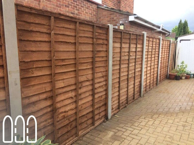 Waney fencing with concrete posts